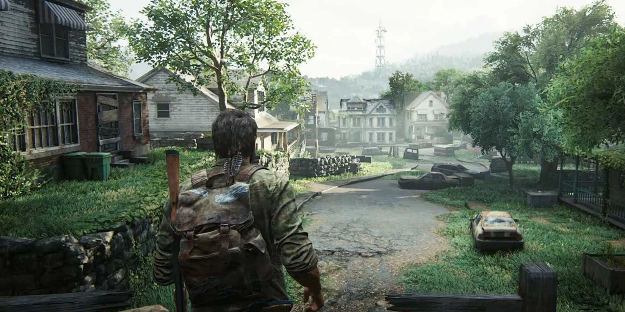 Joel và Ellie đi qua một thị trấn đổ nát trong The Last of Us Part 1
