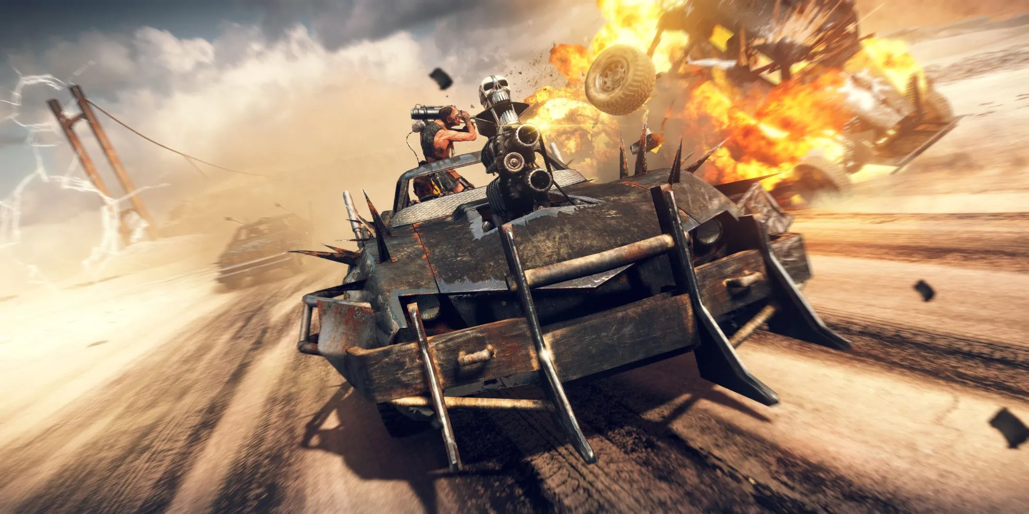 Mad Max lái xe và làm nổ tung một phương tiện khác trong vùng đất hoang