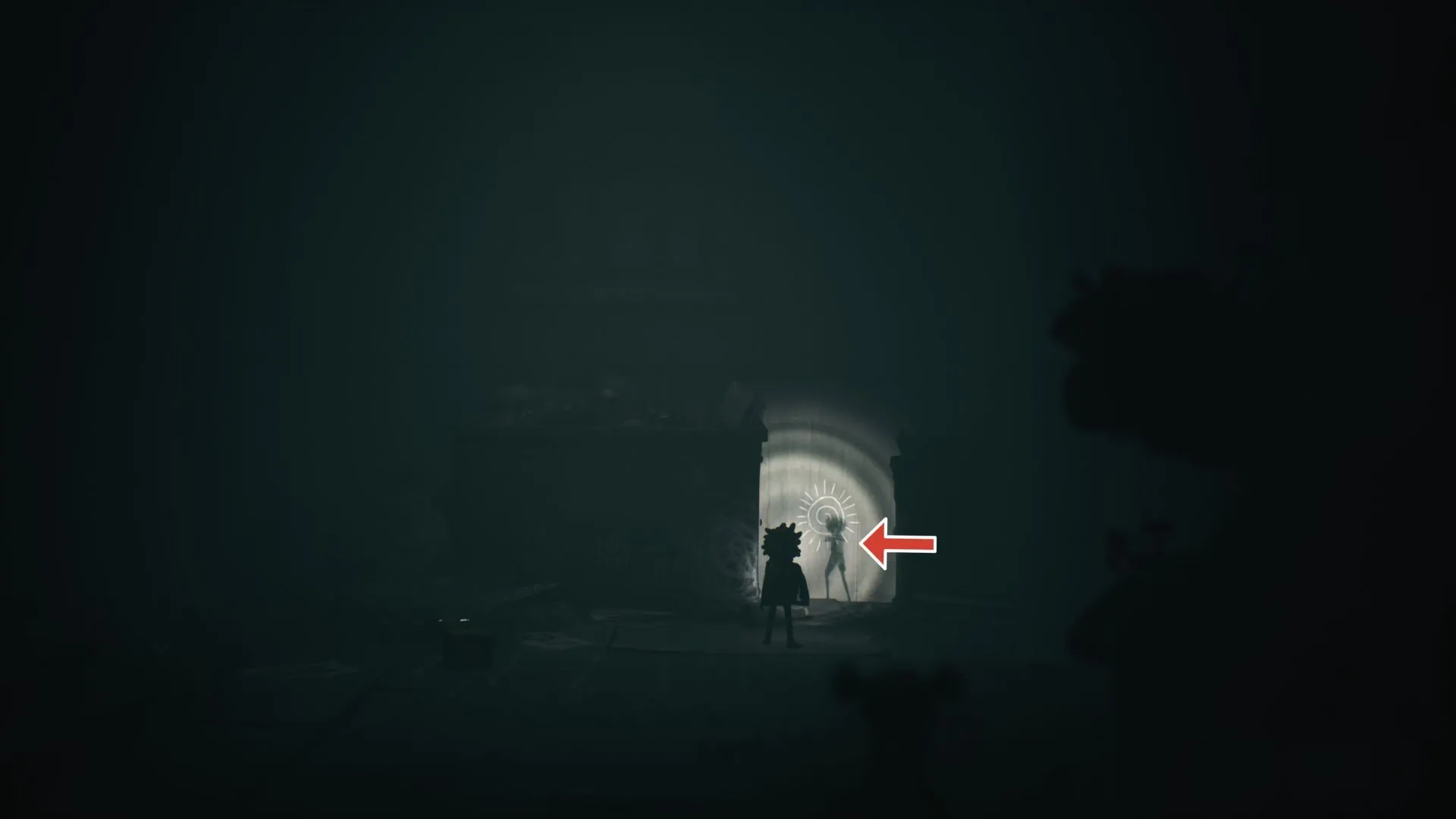 Ghost #2 ngồi vẽ ở hành lang, giữa thùng rác và dumpster